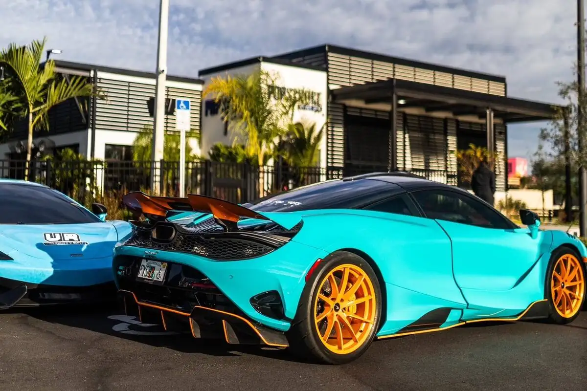 Teal McLaren on gold wheels